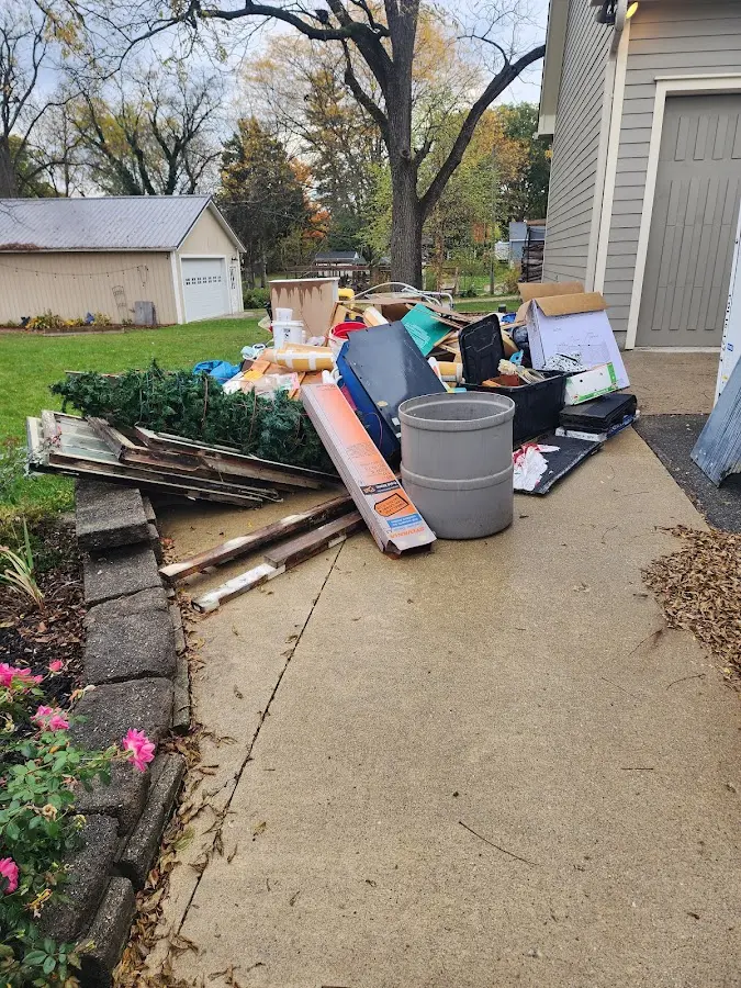 Dumpster being loaded with debris for Residential Dumpster Rental in Clawson